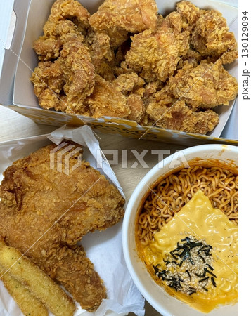 Crispy Korean fried chicken with sweet and spicy glaze paired with fiery buldakmyeon noodles, offering a perfect explosion of bold heat, rich flavor, and satisfying crunch in every bite. 130129094