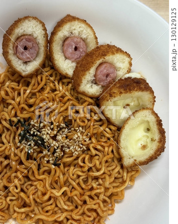 Spicy buldak ramyeon with fiery hot sauce and chewy noodles, delivering an intense, flavorful kick in every bite. A perfect choice for those who crave bold, spicy Korean comfort food. 130129125