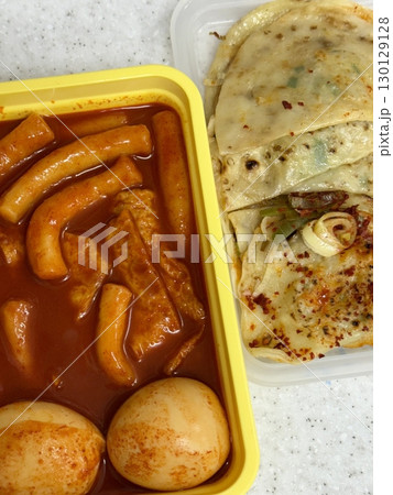 Bunsik, a popular Korean street food, features comforting and savory dishes like tteokbokki (spicy rice cakes), odeng (fish cake skewers), and kimbap (seaweed rice rolls). Perfect for quick meals. Bunsik, a popular Korean street food, features comforting and savory dishes like tteokbokki (spicy rice cakes), odeng (fish cake skewers), and kimbap (seaweed rice rolls). Perfect for quick meals. 130129128