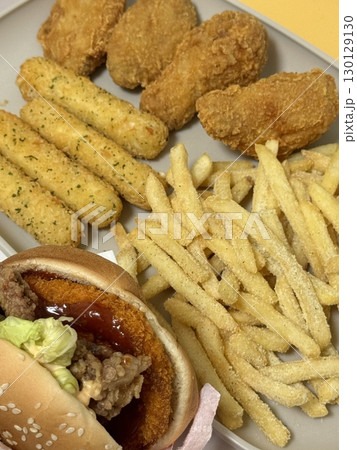 Juicy burger paired with crispy cheese balls and golden french fries. A delicious trio that brings together bold flavors, melty cheese, and satisfying crunch in every bite. Juicy burger paired with crispy cheese balls and golden french fries. A delicious trio that brings together bold flavors, melty cheese, and satisfying crunch in every bite. 130129130