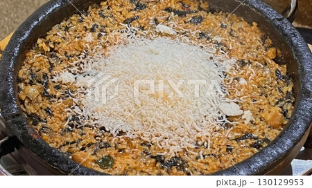 Korean-style Bokkeumbap (fried rice) packed with vibrant flavors, mixed vegetables, and savory seasonings. A classic comfort food thats both satisfying and versatile, ideal for any meal. 130129953