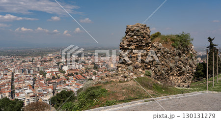 Panoramic view of Manisa city from the historic Manisa Castle ruins, Manisa, Turkey, under a blue sky Panoramic view of Manisa city from the historic Manisa Castle ruins, Manisa, Turkey, under a blue sky 130131279