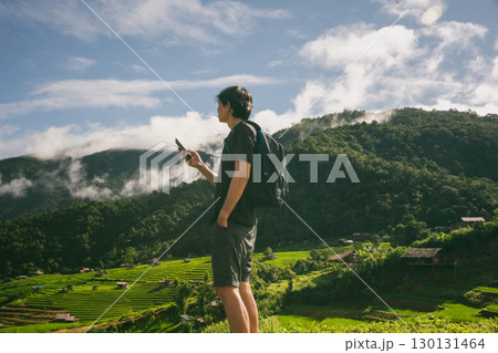 ecology travel with man solo travel and camping outdoor relax in rice field at chiangmai thailand in raining season ecology travel with man solo travel and camping outdoor relax in rice field at chiangmai thailand in raining season 130131464