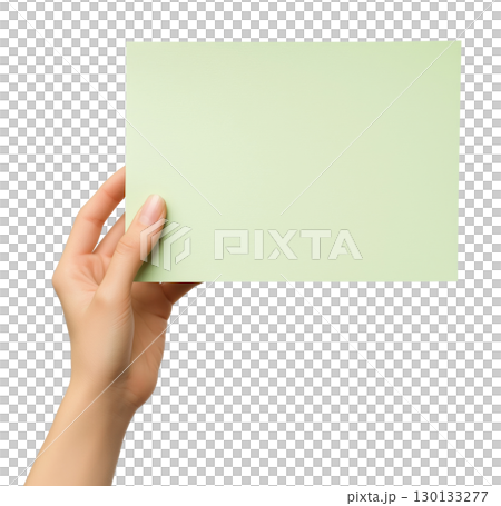 Hand holding blank light green paper 130133277