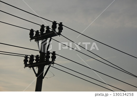 view of electricity tower in the twilight sky view of electricity tower in the twilight sky 130134258