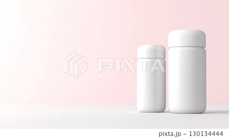 Two multivitamin capsules with white and gray packaging are set against a soft pastel background, showcasing their sleek design 130134444