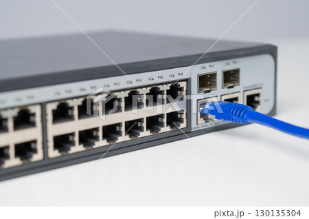 Connecting Ethernet Cable to Network Switch.  130135304