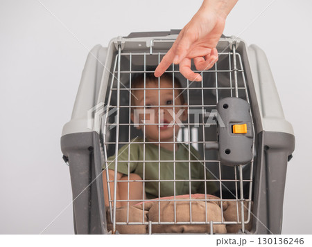 A small child in a closed cage. A small child in a closed cage. 130136246