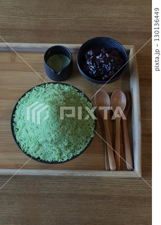Refreshing matcha bingsu with fluffy shaved ice, rich green tea flavor, sweet red beans, and chewy rice cakes. A perfect balance of earthy, creamy, and sweet flavors for a delightful dessert! Refreshing matcha bingsu with fluffy shaved ice, rich green tea flavor, sweet red beans, and chewy rice cakes. A perfect balance of earthy, creamy, and sweet flavors for a delightful dessert! 130136449