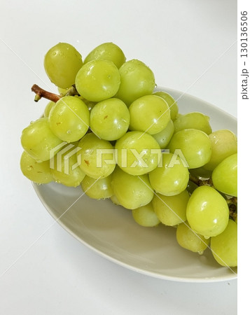 Fresh Shine Muscat grapes, known for their crisp texture and sweet, refreshing taste. Perfect for showcasing premium fruit, ideal for food photography, healthy eating concepts, and gourmet projects. Fresh Shine Muscat grapes, known for their crisp texture and sweet, refreshing taste. Perfect for showcasing premium fruit, ideal for food photography, healthy eating concepts, and gourmet projects. 130136506