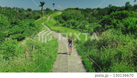 Campuhan Ridge Walk is a famous free and easy hiking path in Ubud, a town on the Indonesian island of Bali, offering stunning views of the surrounding jungle and rice paddies 130136670