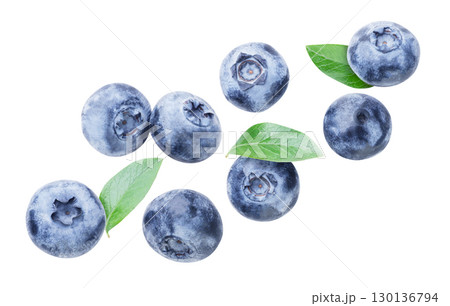 Blueberries with leaves flying close-up on a white. Isolated 130136794