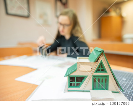 Caucasian young woman making drawings. Student of architecture university. Caucasian young woman making drawings. Student of architecture university. 130137093