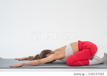 Caucasian woman doing sports exercises on white background. Caucasian woman doing sports exercises on white background. 130137381