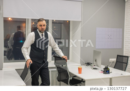 Portrait of a Caucasian mature man in the office.  130137727