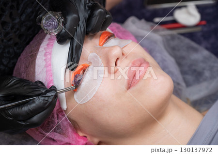 The process of professional lamination and tinting of eyelashes in the salon. The process of professional lamination and tinting of eyelashes in the salon. 130137972