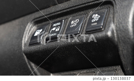 Buttons on the dashboard of an electric vehicle. 130138037