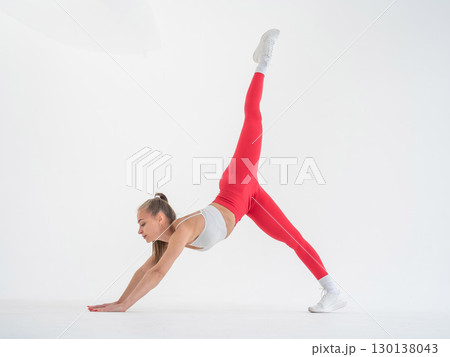Caucasian woman doing sports exercises on white background. Caucasian woman doing sports exercises on white background. 130138043