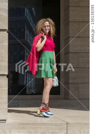 Woman on the background of the business building 130138395
