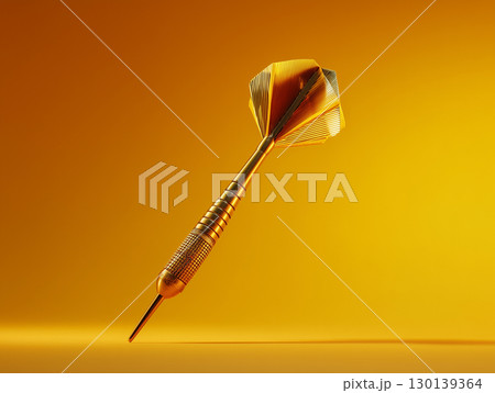 黄金の背景に浮かぶ1本のダーツ ターゲットを象徴するシンプルなダーツの構図 黄金の背景に浮かぶ1本のダーツ ターゲットを象徴するシンプルなダーツの構図 130139364
