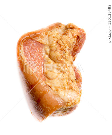 A piece of smoked ham on a white background. A piece of smoked ham on a white background. 130139498