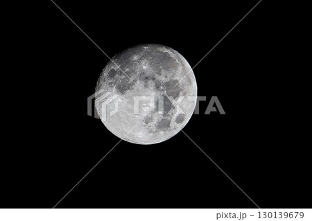 Luminous Full Moon Displaying Intricate Crater Details Against Deep Black Night Sky 130139679