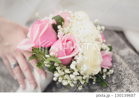 Delicate Pink and White Rose Corsage with Baby's Breath on Bride's Wrist for Wedding Ceremony Delicate Pink and White Rose Corsage with Baby's Breath on Bride's Wrist for Wedding Ceremony 130139687