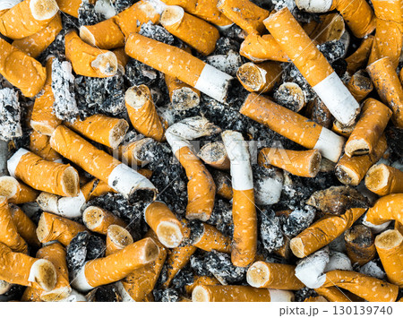 Discarded cigarette butts and ash create powerful anti-smoking awareness campaign visual 130139740