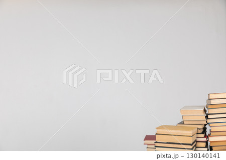 Stacks of educational books for study in the library on a white background Stacks of educational books for study in the library on a white background 130140141