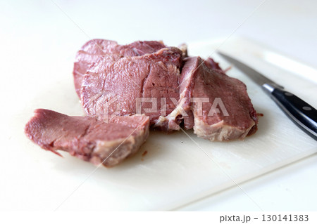 Prepared beef tongue slices on clean board Prepared beef tongue slices on clean board 130141383