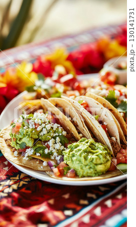 Cinco de Mayo celebration with vibrant tacos and guacamole, perfect for festive background 130141731