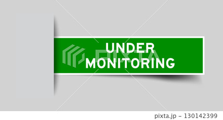 Green color square label sticker with word under monitoring that inserted in gray background Green color square label sticker with word under monitoring that inserted in gray background 130142399