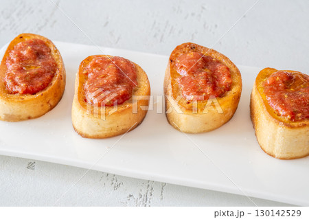 Traditional Pan con Tomate Sandwiches Served on White Plate with Rustic Style 130142529