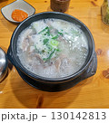 The images show a bowl of steaming dwaeji gukbap, a popular Korean pork soup with rice, served with various side dishes. 130142813
