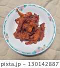 The images show a plate of spicy and savory Korean-style chicken feet, often enjoyed as a popular late-night snack or pub food. 130142887