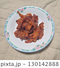 The images show a plate of spicy and savory Korean-style chicken feet, often enjoyed as a popular late-night snack or pub food. 130142888