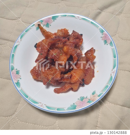 The images show a plate of spicy and savory Korean-style chicken feet, often enjoyed as a popular late-night snack or pub food. The images show a plate of spicy and savory Korean-style chicken feet, often enjoyed as a popular late-night snack or pub food. 130142888