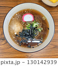 The images show a bowl of cold soba noodles, a refreshing and popular dish often served with broth, shredded seaweed, and green onions. 130142939