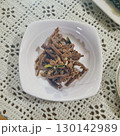The images show a small plate of stir-fried gosari, a popular Korean side dish made from seasoned bracken fern. 130142989