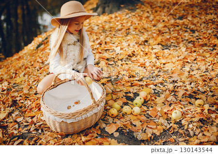 Cute child in a autumn park. Elegant little lady with blonde hair Cute child in a autumn park. Elegant little lady with blonde hair 130143544