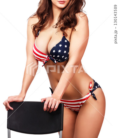 Woman in bikini with the USA flag print, isolated on white background 130143589
