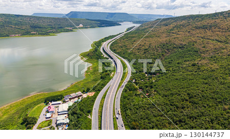 Drone shot The M6 motorway Nakhon Ratchasima Province - Bang Pa-in Lam Ta Khong River and Mountain. Motorway Korat Thailand 130144737