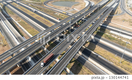Drone shot aerial view of high angle view of intersection across the bridge against the countryside highway Drone shot aerial view of high angle view of intersection across the bridge against the countryside highway 130144741