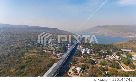Drone shot aerial view landscape of the M6 motorway Expressway Nakhon Ratchasima Province - Bang Pa-in. Lam Ta Khong River and Mountain. Drone shot of scenic landscape rural place traffic. Nakhon Drone shot aerial view landscape of the M6 motorway Expressway Nakhon Ratchasima Province - Bang Pa-in. Lam Ta Khong River and Mountain. Drone shot of scenic landscape rural place traffic. Nakhon 130144743