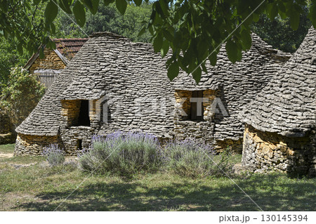 Historic dry stone agricultural buildings in Dordogne, France, showcasing traditional architecture Historic dry stone agricultural buildings in Dordogne, France, showcasing traditional architecture 130145394