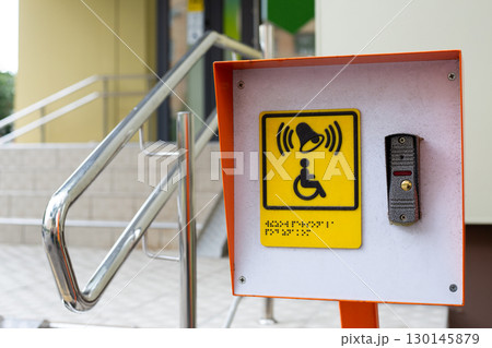 Accessible environment for people with disabilities. Assistance in climbing stairs in public place. Button to call staff for people in wheelchair. Care for incapacitated citizens Accessible environment for people with disabilities. Assistance in climbing stairs in public place. Button to call staff for people in wheelchair. Care for incapacitated citizens 130145879