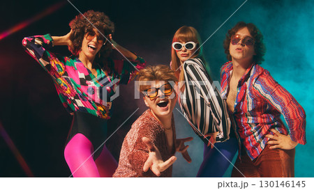 Glam retro group expressing charisma with colorful disco outfits Glam retro group expressing charisma with colorful disco outfits 130146145