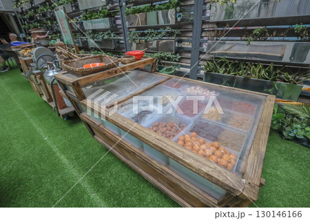 Aug 23 2025 Rustic Outdoor Market Display With Assorted Dried Goods in Wooden Containers 130146166