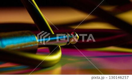 Audio jack connector on colorful background with neon glow 130146257