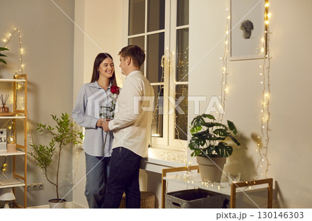 Positive Husband Gives Flowers To Happy Wife For Valentine's Day Gift Positive Husband Gives Flowers To Happy Wife For Valentine's Day Gift 130146303
